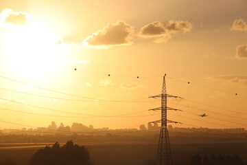 sunset over the city with a Boeing 747 taking off in the background