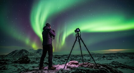 A photographer stands amidst a vibrant aurora borealis, capturing the night sky with a long lens on a tripod