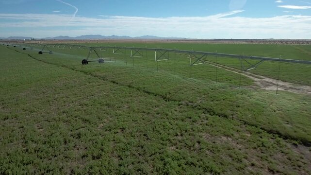 Yuma Arizona USA &ndash; 4K Drone Aerial of Irrigation and Circular Crop Fields with Tractors