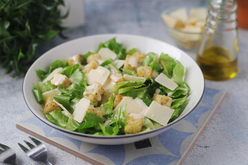 A bowl with classic Caesar salad	