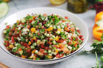 A bowl with traditional Israeli Salad