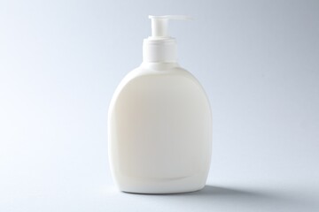 Bottle of cosmetic product on light background. Mockup for design