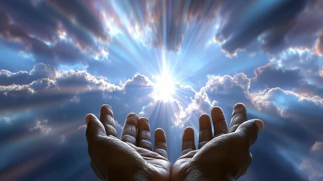 An inspirational background concept of hands receiving a divine blessing from the heavens.