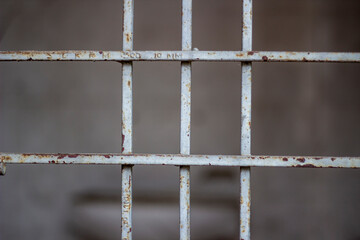 Closeup of rusty metal bars in a prison cell