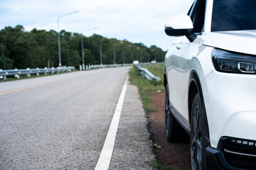 Car stopped by the roadside scenic landscape travel photography tranquil environment side view adventure on the open road