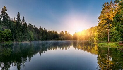 Obraz premium idyllic lake sunrise with warm sunbeams and reflective forest surroundings beautiful landscape for nature tourism and conservation awareness