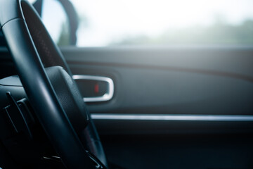 Driving experience inside a car urban setting close-up image bright environment focused perspective