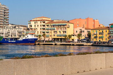 Colorful coastal town with docked ship