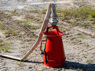 Portable fire foam inductor with hose.