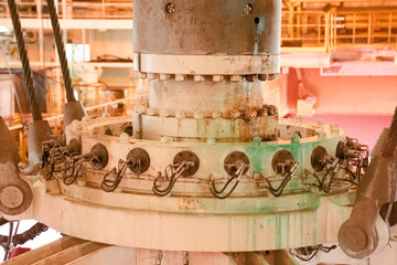 drilling equipment descending into the sea on offshore oil platform.