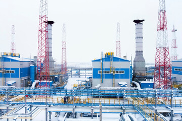 Equipment of the plant for preparation of liquefied gas, winter and snow outside.
