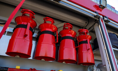 Row of red fire hose strainers.