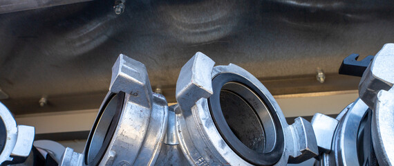 Close-up detail of fire hose couplings.