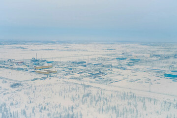 Equipment of the plant for preparation of liquefied gas, winter and snow outside.
