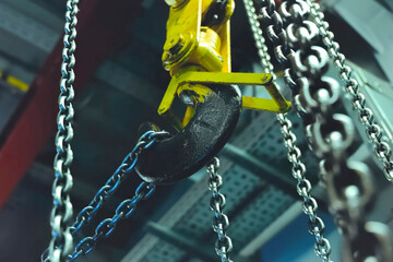 Lifting chains for hoisting cargo with crane hook. Chain on the hook.