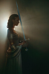 art photo real person fantasy woman queen praying hands holding sword girl in dark room black night castle looking at ray of moon light hope. white golden dress. Elf girl warrior. sharp magic blade