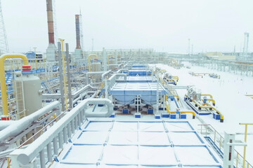 Equipment and pipes of gas treatment station for gas transport to an LNG plant.