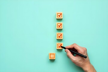 Hand marking a checklist with checkmarks on wooden blocks