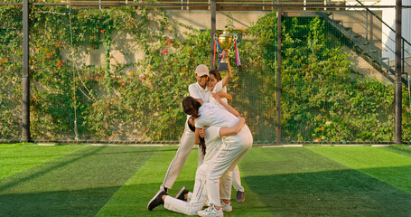 Indian young adult gen z sports woman lady group win match held award in hand raise up enjoy day time happy female team cheering have fun joy do hug at play ground place