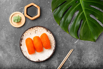 A vibrant sashimi on grey background top view