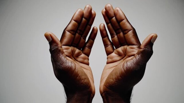 The Cupped Hands of Man with Dark Skin Tone, Isolated on Plain Background