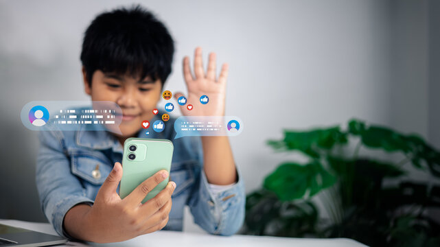 Happy boy using smartphone for social media live streaming, online communication and digital lifestyle