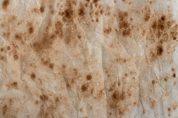 old brown paper with grunge spots - texture background