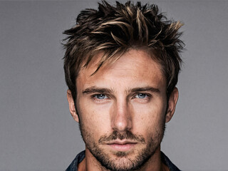 Rugged spiky messy hairstyle on Caucasian man with natural texture