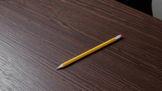 graphite writing implement placed on office work surface table. Overhead perspective with available copy space. Captured using Nikon D810 camera at ISO64.