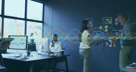 Presenter gesturing at chart wall coworker typing tablet for business planning with pulsating waves - Powered by Adobe