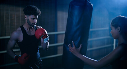 Indian young adult gen z angry fit boxer man guy wear gloves do hand fist boxing punch beat hit on...