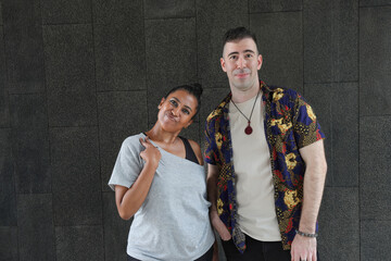 Asian Indian adult woman and Caucasian adult man urban rooftop outdoor casual pose walk talk activity friend colleague various expression