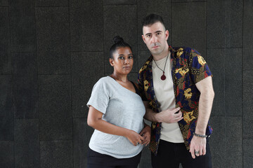 Asian Indian adult woman and Caucasian adult man urban rooftop outdoor casual pose walk talk activity friend colleague various expression