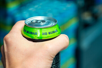 Refreshing Beverage Can Held Firmly By Hand