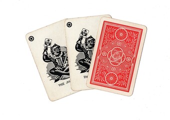 A hand of three vintage playing cards with two cards revealed on a white background.