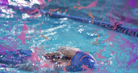 Swimmer kicking off competition lap extending left arm over lane rope and powering pull for speed