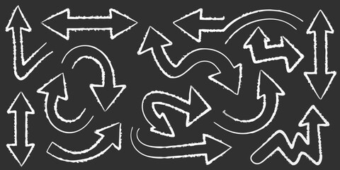 Assortment of white chalk-style hand drawn arrows on a dark grey background direction