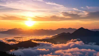 Obraz premium Layered mountains fade into the distance, with soft clouds and golden sunlight.
