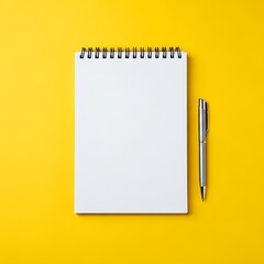 Blank notebook and pen on yellow background