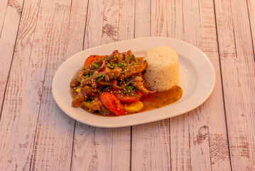 A modern reinterpretation of lomo saltado with wagyu beef, pickled shallots, and purple sweet potato chips, fusing tradition and avant-garde