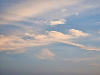 Beautiful white clouds and orange sky on the blue sky perfect in the afternoon for the background