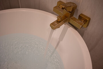 Water poured into the tub. Full bath.