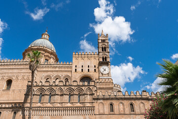 View of one of the four bell towers of Palermo Cathedral, featuring the only tower with a clock. Sicily, Italy