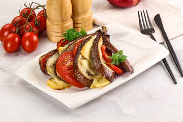 Baked tomato with mozzarella and tomato