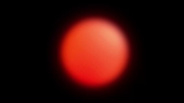 Abstract red glowing orb, blurry grainy gradient shape, looped animated background