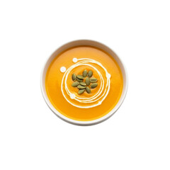 Top view of creamy orange soup garnished with pumpkin seeds and swirled cream transparent background