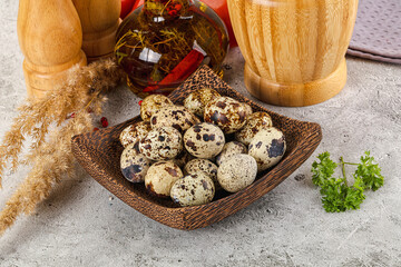 Raw quail egg in the bowl