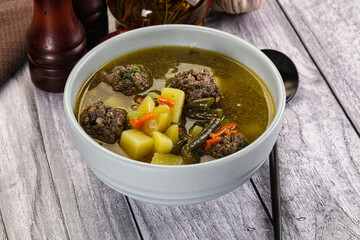 Soup with beef meatballs and vegetables