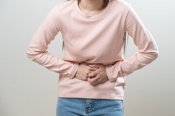 Flatulence asian young woman intolerance hand in stomach ache, suffer from food poisoning,...