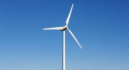 Wind turbine against clear blue sky